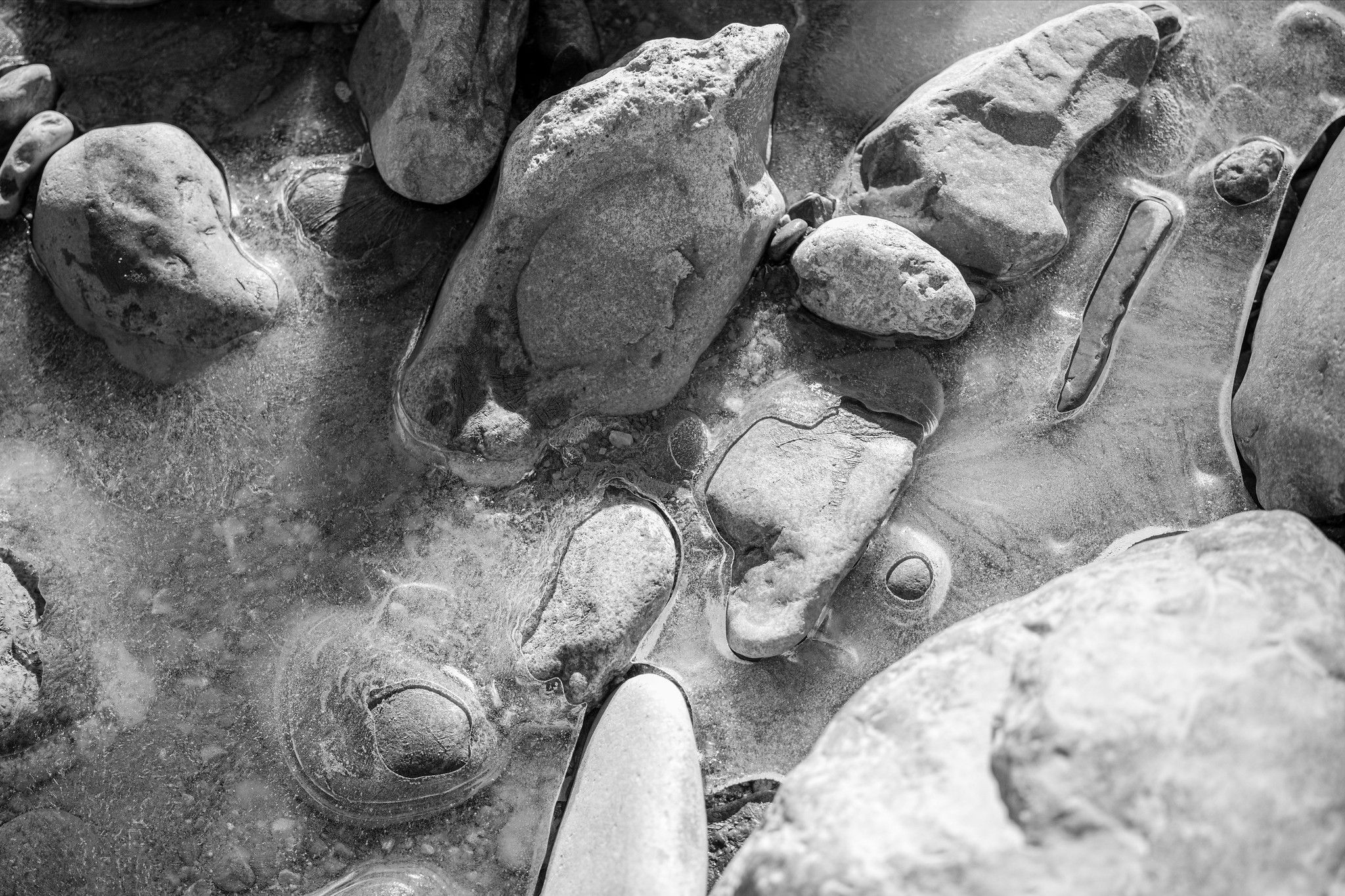 Rounded stones set in clear ice